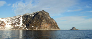 The headland of Høgneset on the island of Parryøya, with the island of Nelsonøya